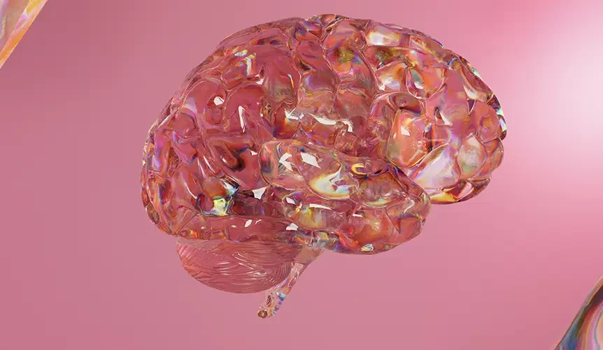 Abstract 3D render of a translucent, iridescent human brain floating against a soft pink background, surrounded by reflective, glass-like shapes with rainbow highlights.